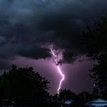 Dramatic lightning illuminates a stormy night sky over suburban Chico, CA.